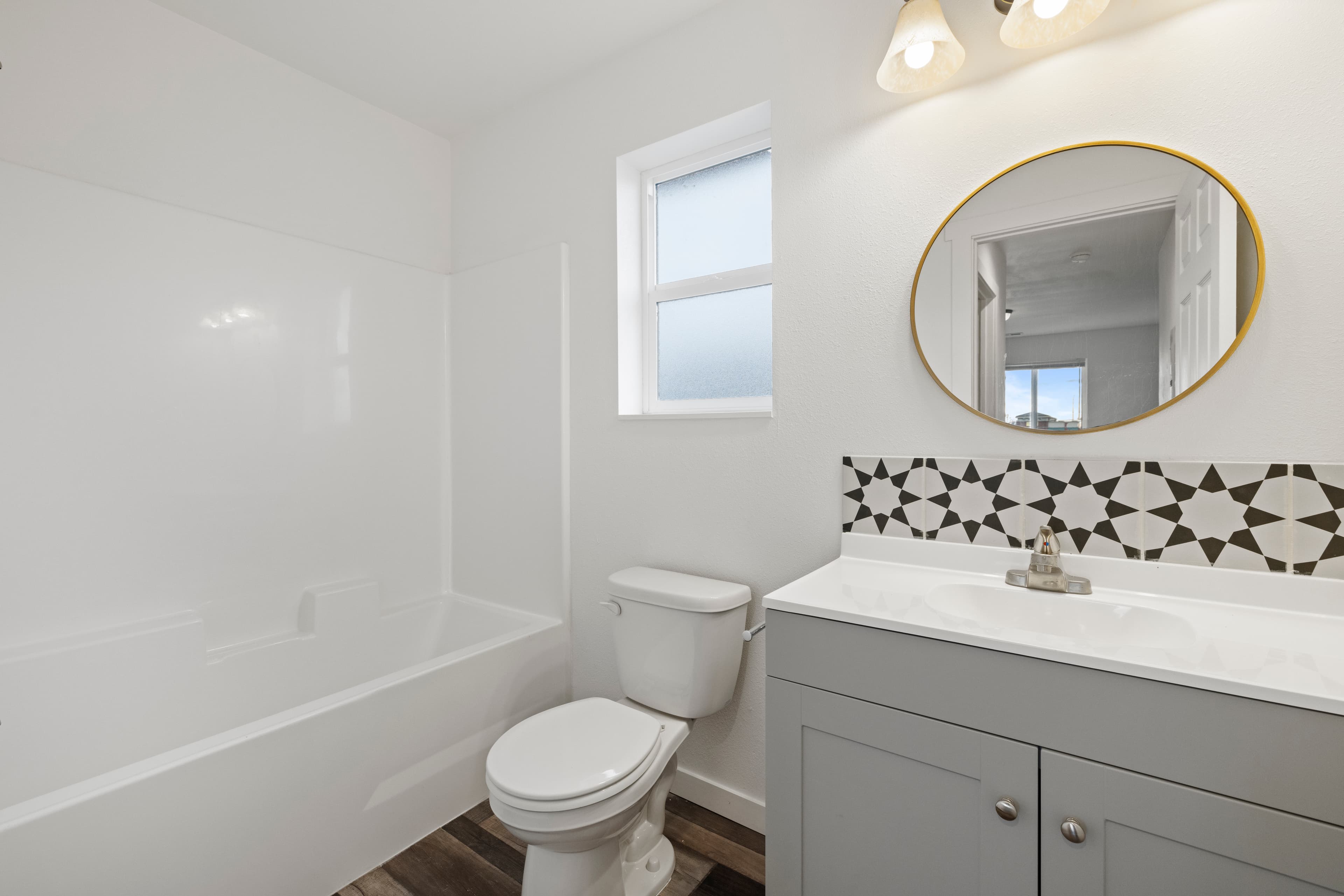 Modern Townhomes for Rent in Moses Lake, WA — Tile and vanity in a Marina Shore Villas townhome bathroom