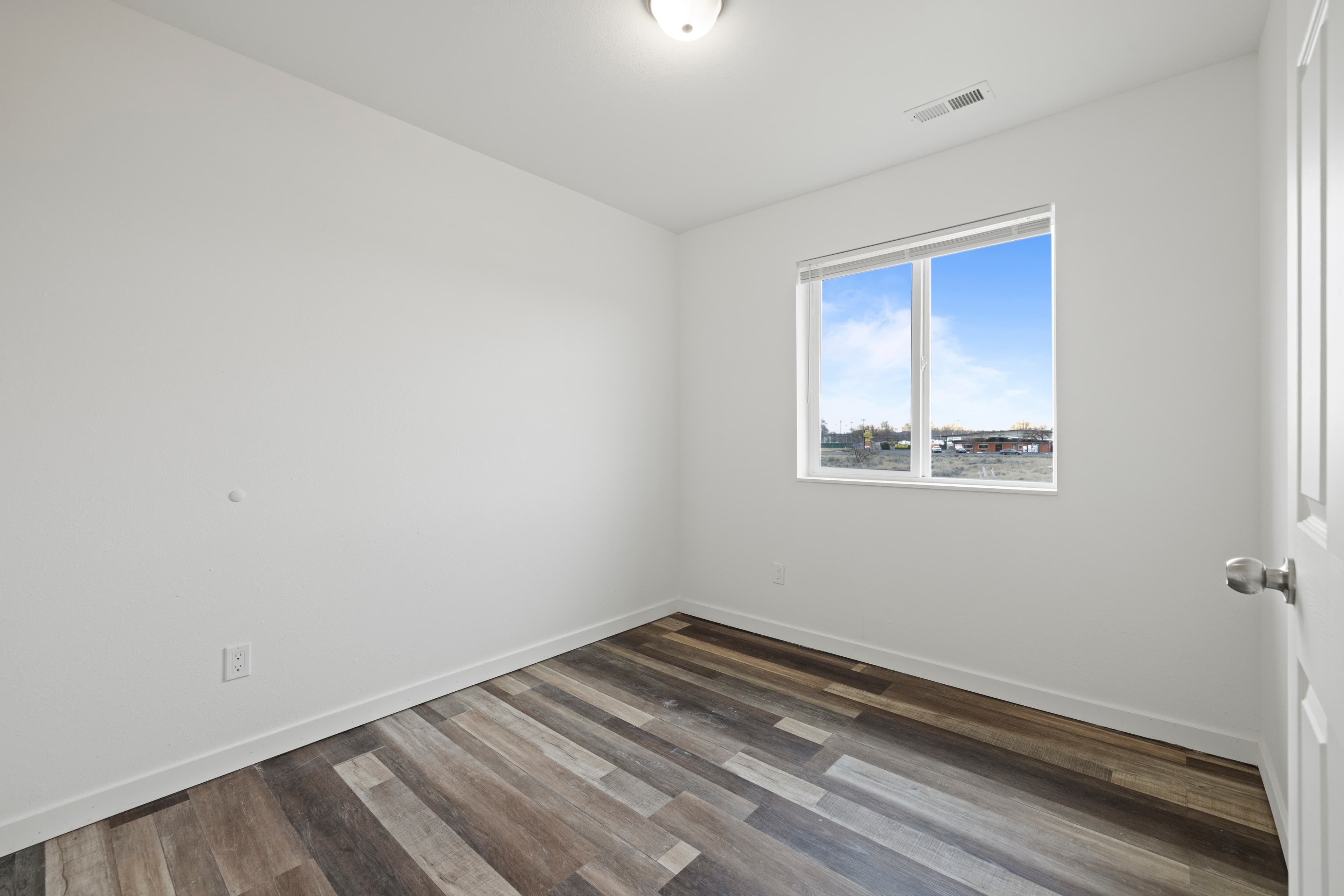 Townhomes in Moses Lake for Aerospace Workers — Bedroom with natural light in a Marina Shore Villas townhome