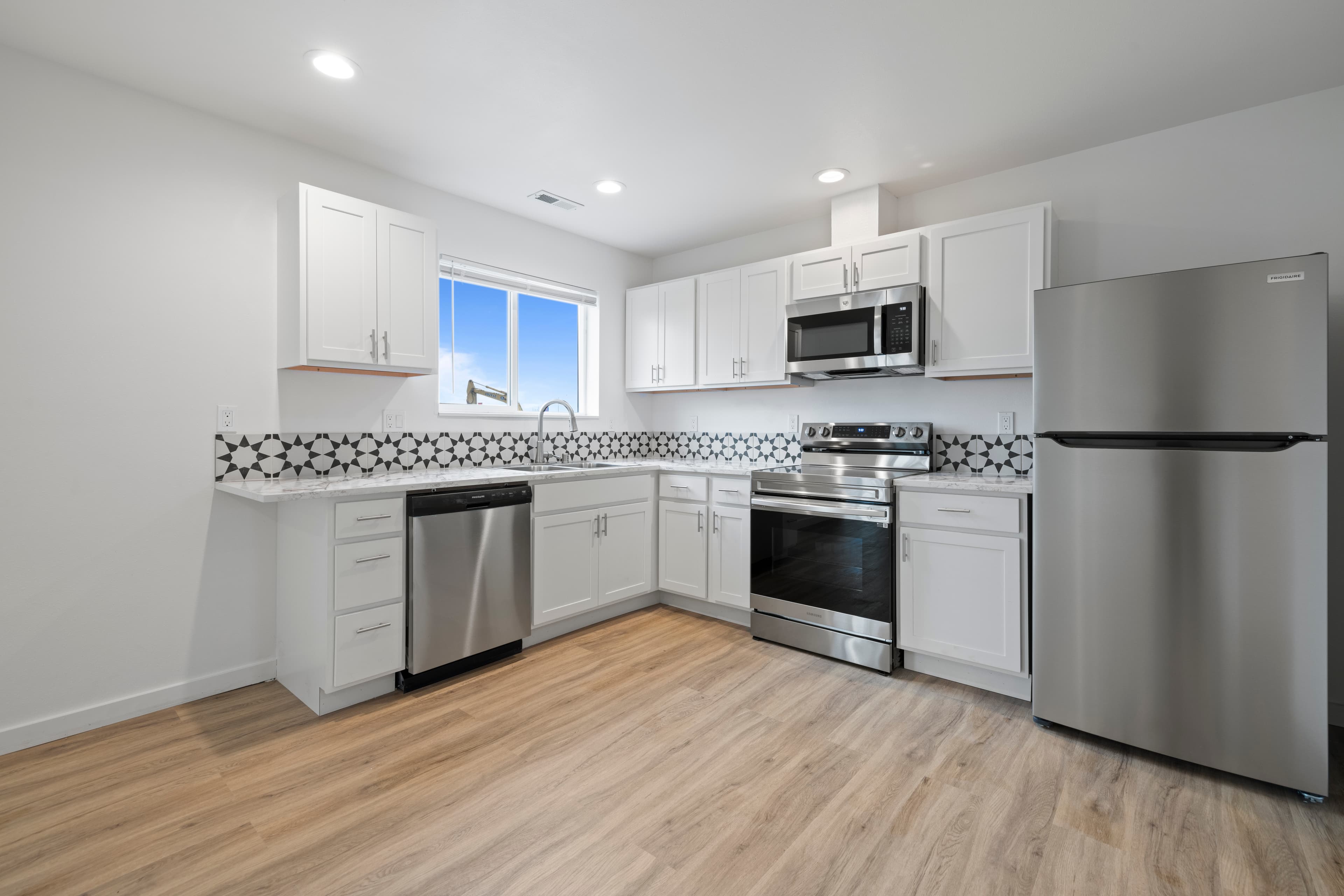 Townhomes With Washer & Dryer Included in Moses Lake — Kitchen island and cabinetry inside a Marina Shore Villas townhome