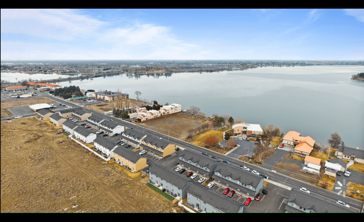 Marina Shore Villas building exterior with on-site parking